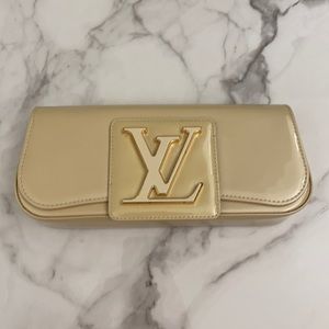 Louis Vuitton cream clutch